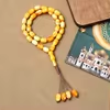مسبحة أكريليك 33 حبة بيضاوية 10 × 15 مم — E5-33B-2 — أصفر — E5-33B-2-K5