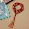 مسبحة أكريليك 99 حبة وشرابة بسبعة خيارات — F1-99E4-1 — بني محمر في الصورة — Orange