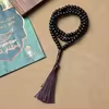 مسبحة أكريليك 99 حبة وشرابة بسبعة خيارات — F1-99E4-1 — داكن قريب من الأسود مع شرابة بنفسجية — Brown