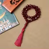 مسبحة أكريليك متعددة الأوجه 33 حبة 12 مم — I12-33E4-1 — خمري بشرابة وردية داكنة — I12-33E4-1-L19