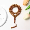مسبحة أكريليك 33 حبة مستديرة بنهاية خرزية — A4-33C-2 — Brown