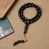 مسبحة أكريليك من 33 خرزة بيضاوية 10×13 مم – E3-33C4 — Black-1 — أسود كما في صورة هذا الرمز، مع خيط بني ظاهر