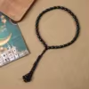 مسبحة أكريليك من 33 خرزة بيضاوية 10×13 مم بشرابة خيط – E3-33E1-2 — Black — أسود مع شرابة سوداء