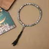 مسبحة أكريليك من 33 خرزة بيضاوية 10×13 مم بشرابة خيط – E3-33E1-2 — Silver — رمادي متدرج مع شرابة داكنة