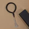 مسبحة أكريليك 33 حبة بشكل برميلي بتعليقات هلال ونجمة — H42-33G-1 — أسود داكن — H42-33G-1-L153