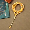 مسبحة أكريليك 99 حبة 7×9 مم بنهاية خيط قصيرة — أصفر وكريمي مموج