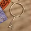 مسبحة أكريليك 12 مم بحبات مخططة ونهايات خرزية — A70-33A-1 — رمادي بيج بخطوط فاتحة — A70-33A-L9