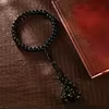 مسبحة أكريليك 33 حبة مسطحة 11×8 مم بشرابة مضفّرة — F3-33E1-2 — أسود مع شرابة سوداء — F3-33E1-2-L1
