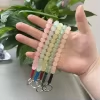 مسبحة قصيرة من 25 خرزة مع حلقة متعددة الألوان – SA3-25-E — Multi — خيار متعدد الألوان؛ تعرض الصورة خرزًا بدرجات فاتحة مع حلقات وخيوط مختلفة