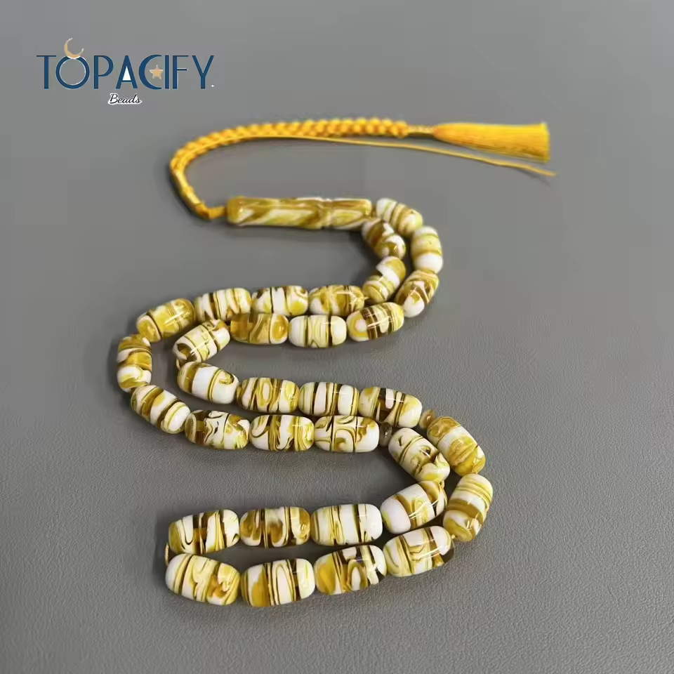 مسبحة أكريليك وراتنج 33 خرزة بيضاوية 9×16 مم بنقشة رخامية كهرمانية وبنية وشرابة صفراء – SA11-33E32-J2 — صورة المنتج 1 مسبحة أكريليك وراتنج 33 خرزة بيضاوية 9×16 مم بنقشة رخامية كهرمانية وبنية وشرابة صفراء – SA11-33E32-J2 — صورة المنتج 1